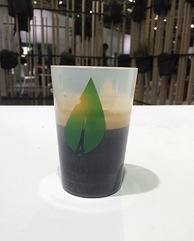 Reusable coffee cup with the COP21 logo from United Nations Climate Change Conference in Le Bourget, outside Paris, France.