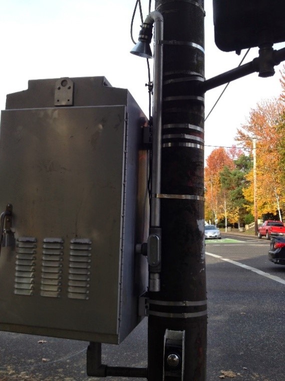 the pole mounted traffic signal cabinet in which our air quality monitoring station is housed. The cabinet is dedicated to air quality equipment.