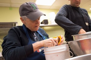 Administrator Gina McCarthy prepares food in Miriam's Kitchen